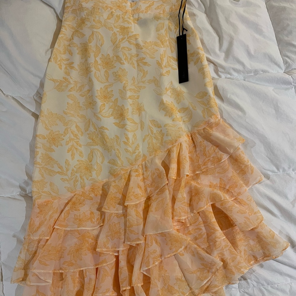 Asymmetric skirt with ruffle detail and belt from House of Harlow.